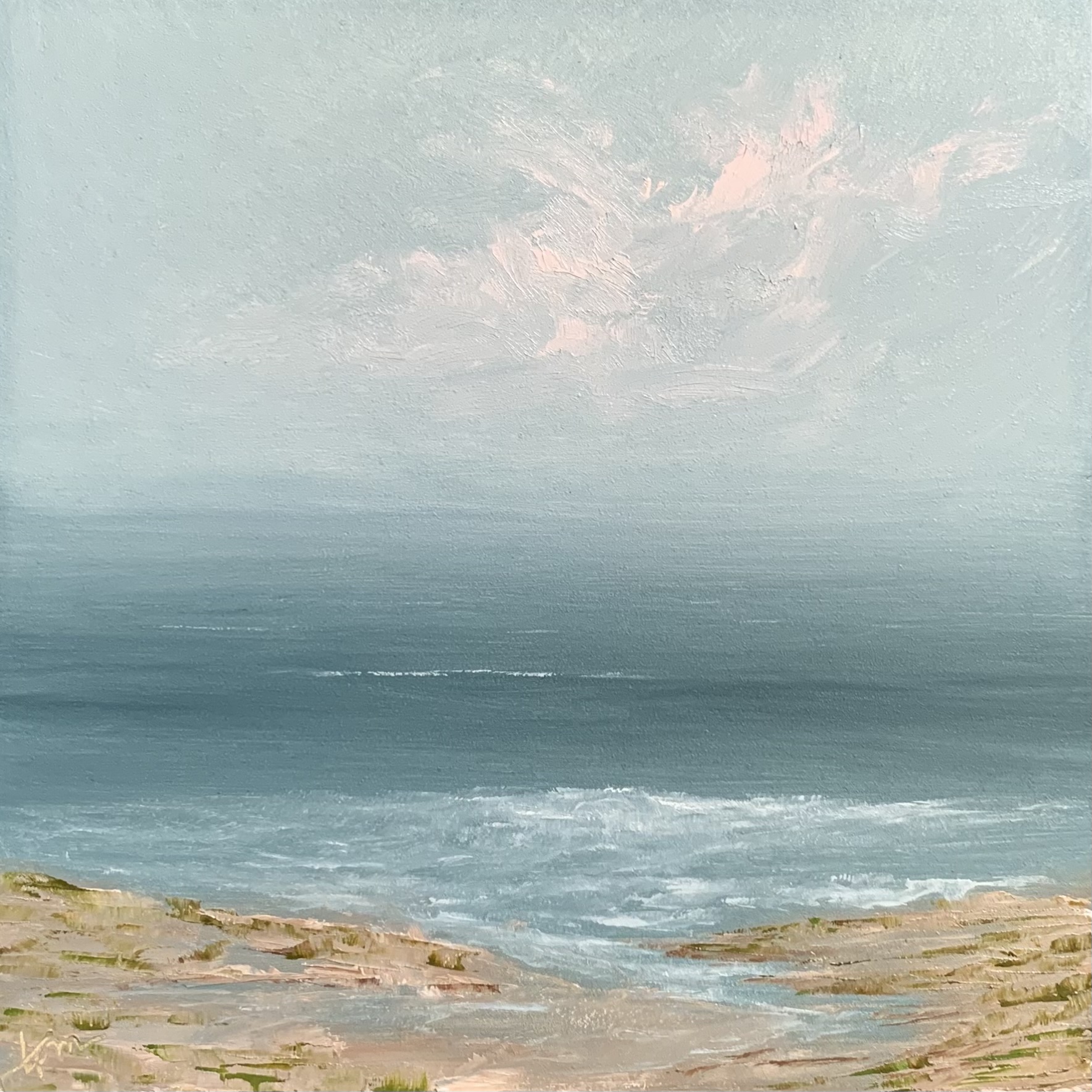 Photo of an original seascape painting by Tisha Mark, “Little Seaside Visits No. 3” 6”x6” oil on Gessobord (2023). This seascape features a soft springtime color palette with soft pink clouds in a blue sky over peaceful ocean. The shore features bits of sea grass just greening up.