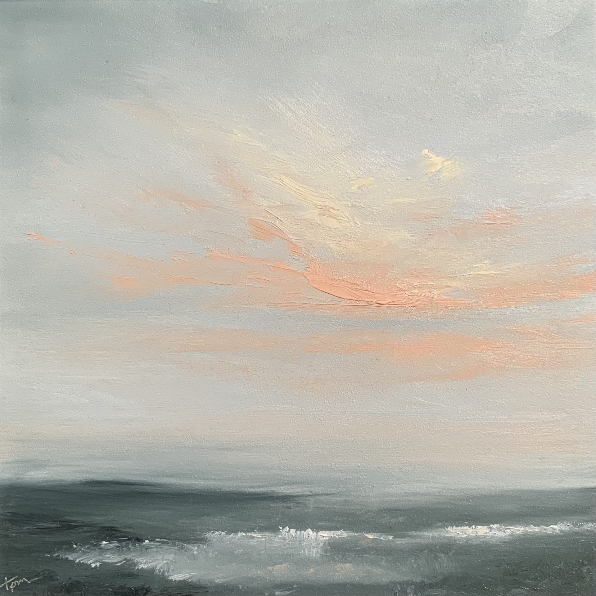 Original seascape oil painting by Tisha Mark, "Week 23, 52 Weeks of Finding Light Series" 6"x6" oil on gessobord (2023). Painting is a moody seascape painted in a limited palette of mostly gray tones, featuring orange and yellow sunlit clouds over an atmospheric seashore.