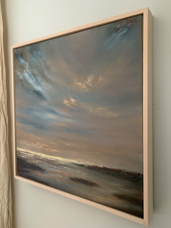 Original seascape oil painting by Tisha Mark, "Sunset on Opening Day" 20"x20" oil on linen (2024), shown here in an unfinished maple strip frame at an angle from right.