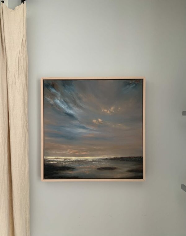 Original seascape oil painting by Tisha Mark, "Sunset on Opening Day" 20"x20" oil on linen (2024), shown here in an unfinished maple strip frame, in situ.